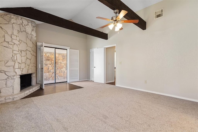 unfurnished living room with carpet, visible vents, vaulted ceiling with beams, ceiling fan, and a stone fireplace