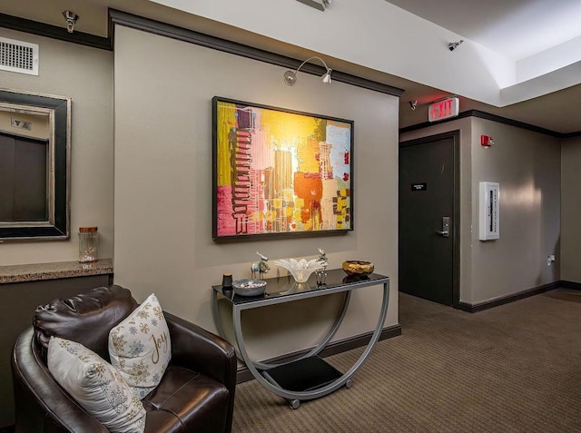 interior space featuring visible vents, carpet floors, and baseboards