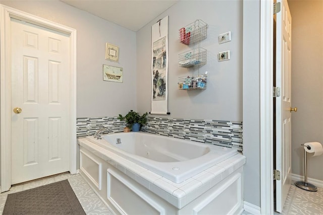 full bath with a garden tub and tile patterned floors