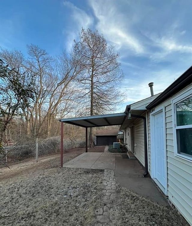 view of yard featuring a patio and fence