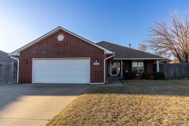 ranch-style house featuring a garage, brick siding, fence, driveway, and a front yard