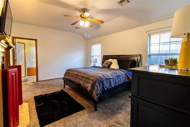 carpeted bedroom with lofted ceiling, ceiling fan, visible vents, and baseboards