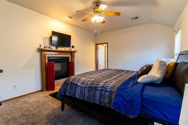 bedroom with carpet, visible vents, a multi sided fireplace, vaulted ceiling, and baseboards