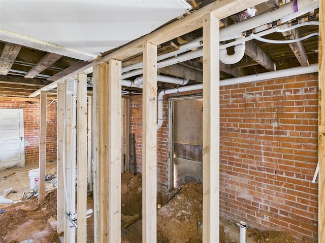 miscellaneous room with brick wall