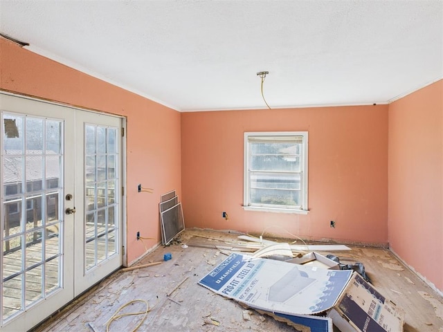 empty room with french doors and ornamental molding