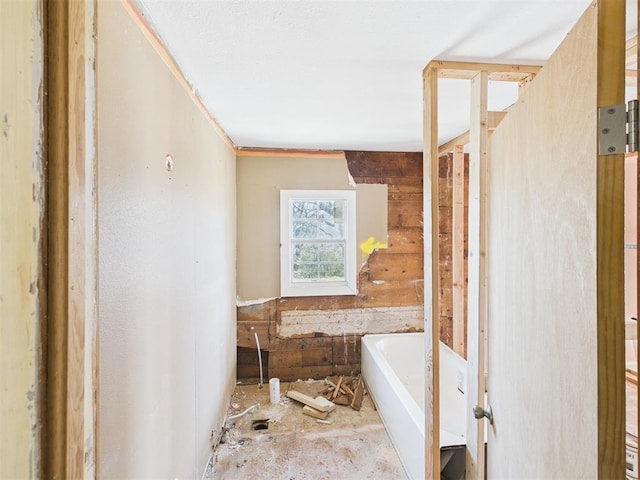 bathroom featuring a soaking tub