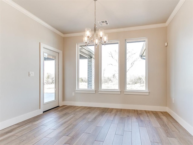 unfurnished dining area with visible vents, baseboards, light wood-style flooring, and crown molding