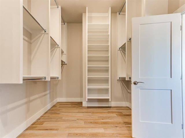 spacious closet with light wood-style floors