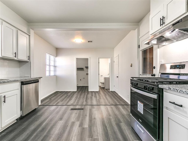 2208 N Hood St, Oklahoma City, OK 73111 - kitchen with stainless steel appliances, under cabinet range hood, dark wood-style floors, and white cabinetry