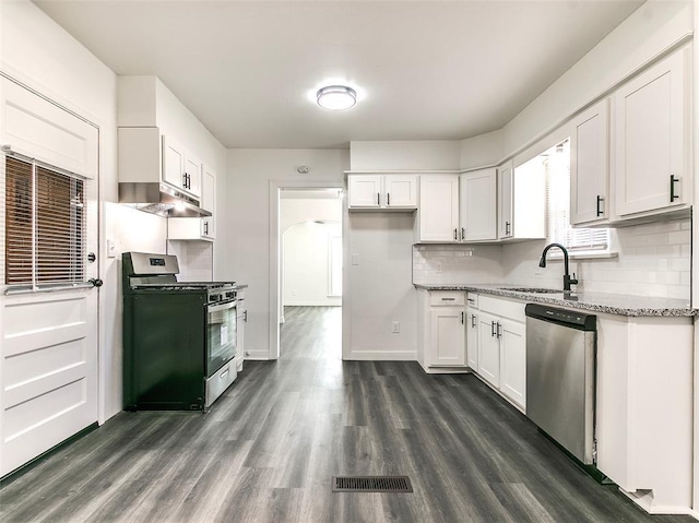 2208 N Hood St, Oklahoma City, OK 73111 - kitchen with stainless steel appliances, a sink, light stone counters, dark wood-type flooring, and white cabinets