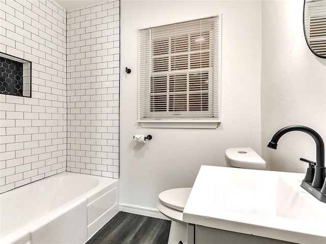 2208 N Hood St, Oklahoma City, OK 73111 - full bath featuring toilet, wood finished floors, baseboards, vanity, and shower / bath combination