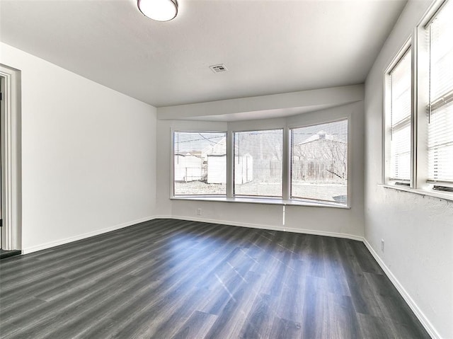 2208 N Hood St, Oklahoma City, OK 73111 - unfurnished room with dark wood-style floors and baseboards