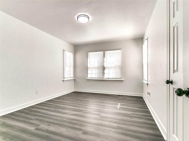 2208 N Hood St, Oklahoma City, OK 73111 - unfurnished room featuring dark wood-type flooring and baseboards