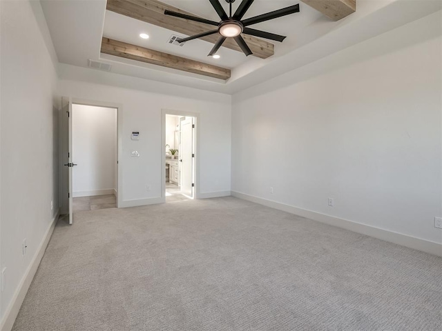 unfurnished bedroom with recessed lighting, a raised ceiling, visible vents, light carpet, and baseboards