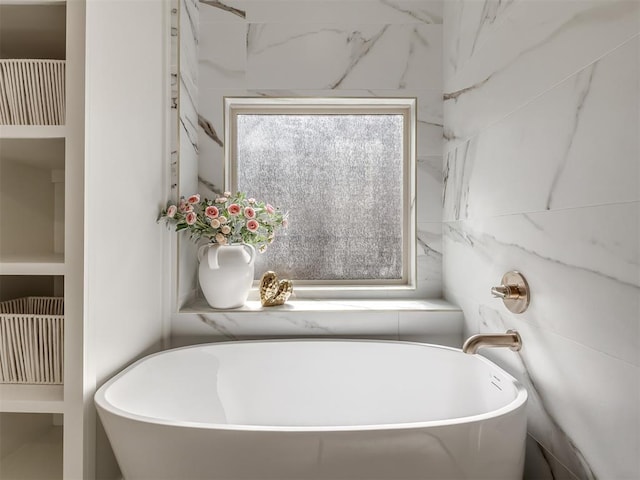 bathroom featuring a freestanding bath