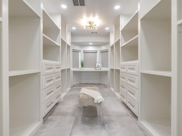 spacious closet featuring visible vents