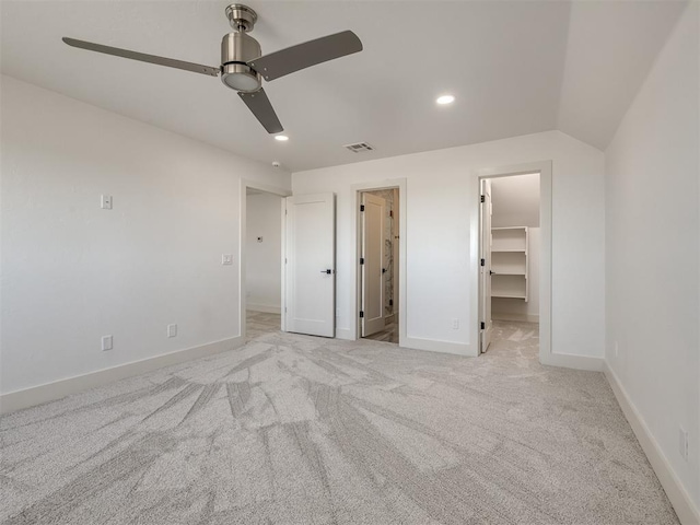 unfurnished bedroom with recessed lighting, visible vents, baseboards, a spacious closet, and carpet