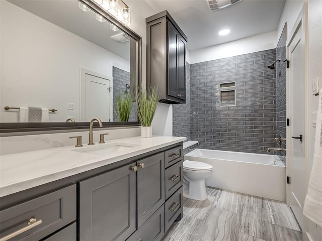 full bath with toilet, shower / bath combination, vanity, and visible vents