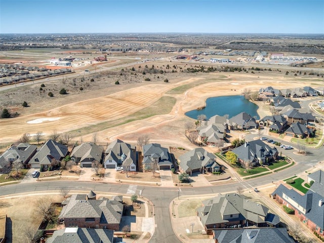 aerial view featuring a residential view and a water view