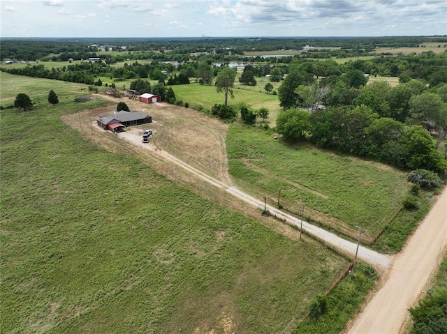 birds eye view of property featuring a rural view