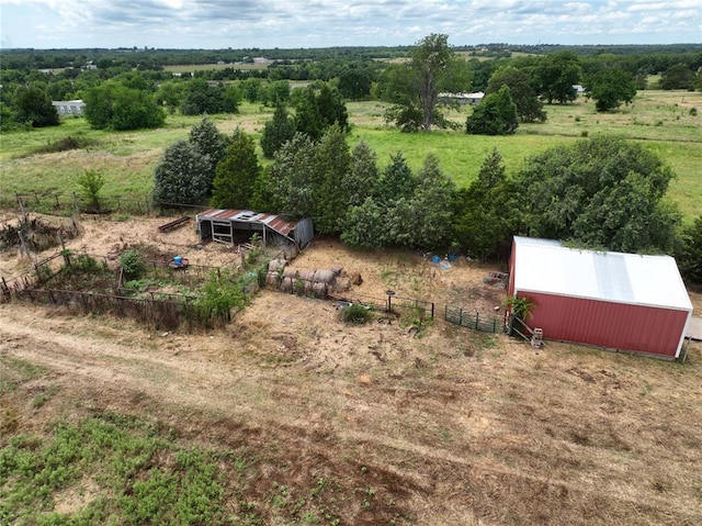 exterior space with fence and an outbuilding