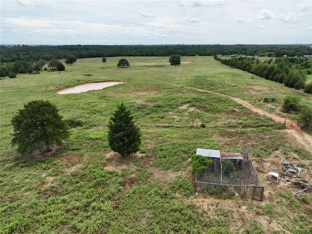 birds eye view of property featuring a rural view