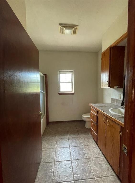 bathroom with visible vents, vanity, and toilet