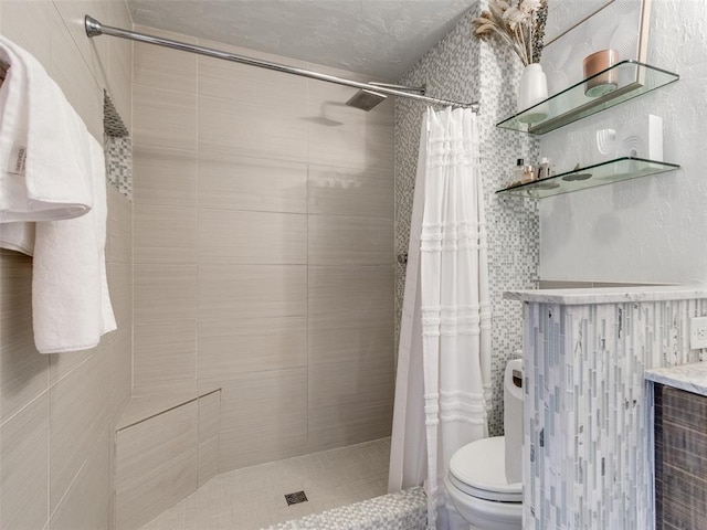 bathroom featuring a shower stall and toilet