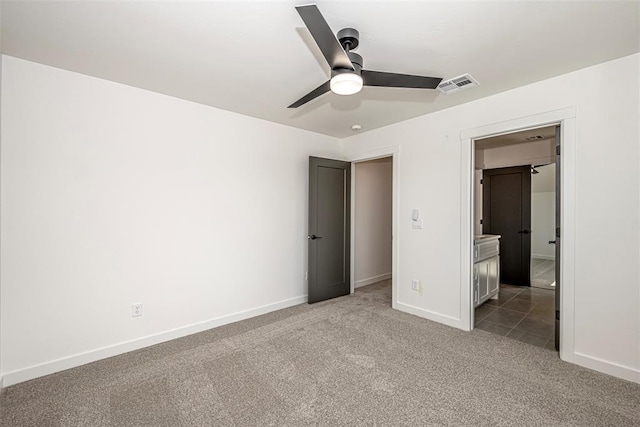 4125 Emery Dr, Edmond, OK 73034 - unfurnished bedroom featuring carpet floors, baseboards, and ceiling fan