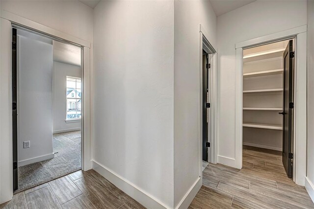4125 Emery Dr, Edmond, OK 73034 - hall featuring wood finish floors and baseboards