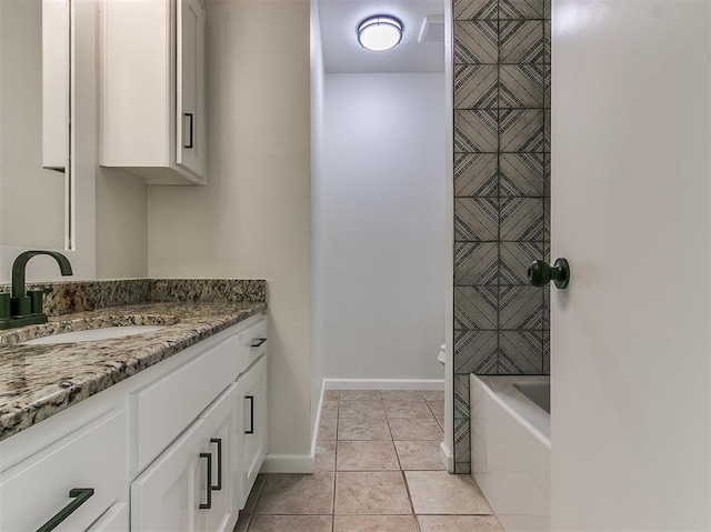 bathroom featuring shower / bath combination, tile patterned flooring, baseboards, and vanity