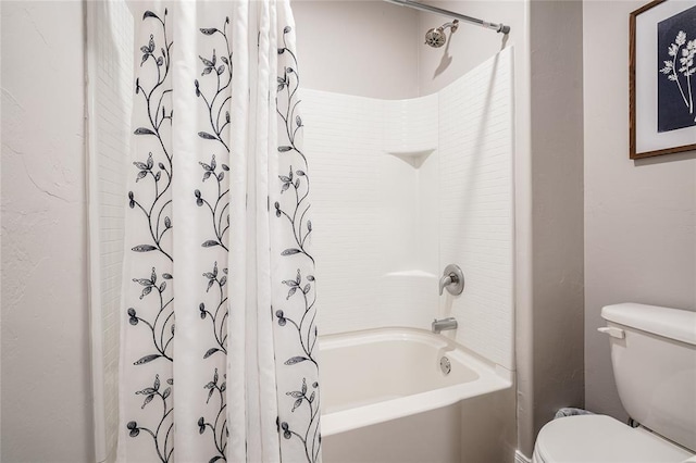 full bath featuring shower / bath combo with shower curtain and toilet