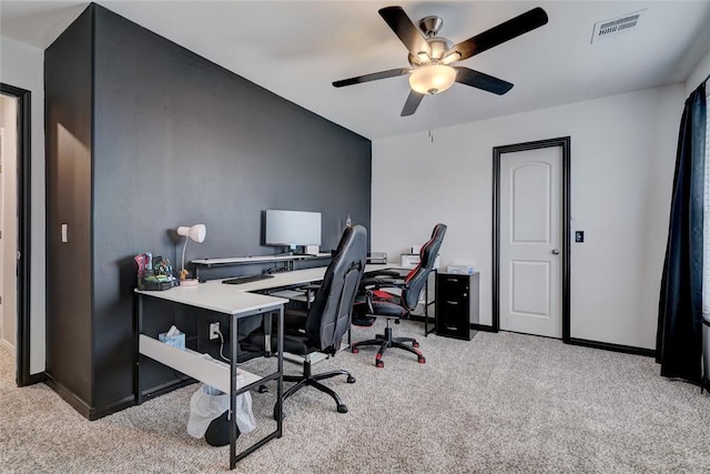 office space with baseboards, visible vents, ceiling fan, and carpet flooring