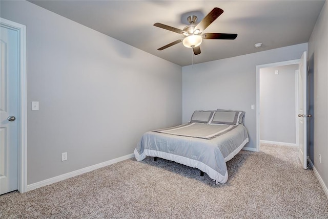 bedroom with carpet floors, baseboards, and a ceiling fan