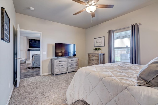 bedroom featuring carpet, baseboards, and a ceiling fan