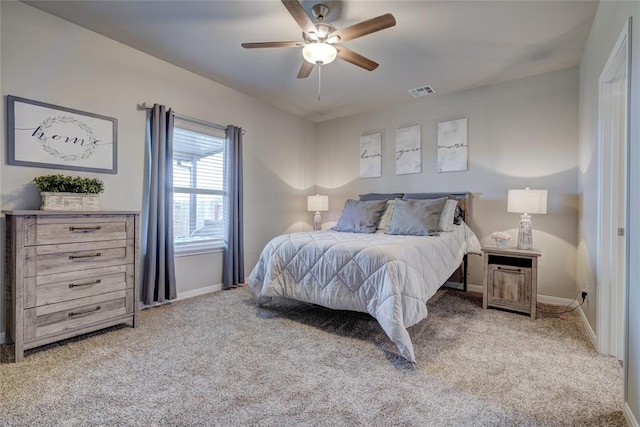 bedroom with carpet, visible vents, baseboards, and ceiling fan