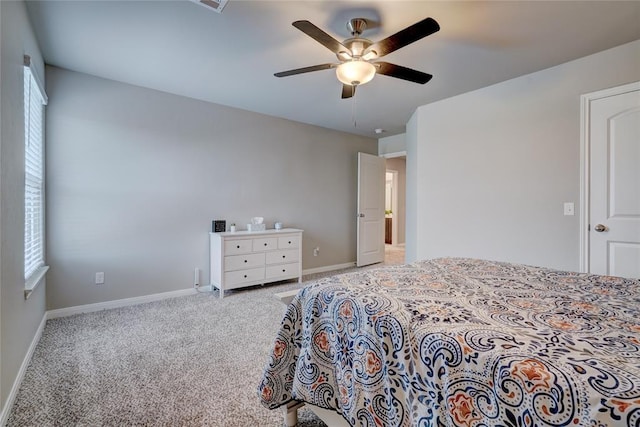 carpeted bedroom featuring ceiling fan and baseboards