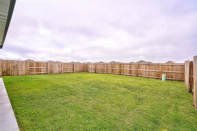 view of yard featuring a fenced backyard