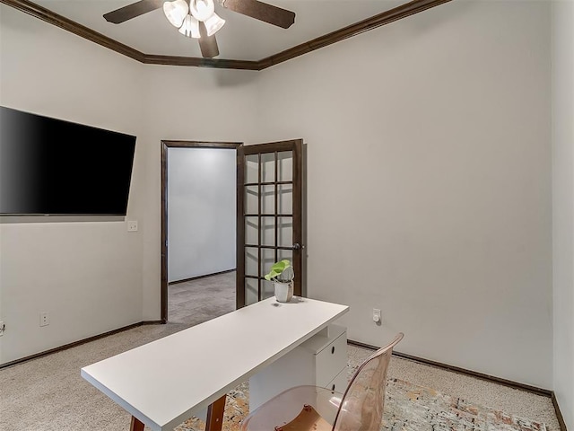 home office featuring crown molding, light carpet, baseboards, and ceiling fan