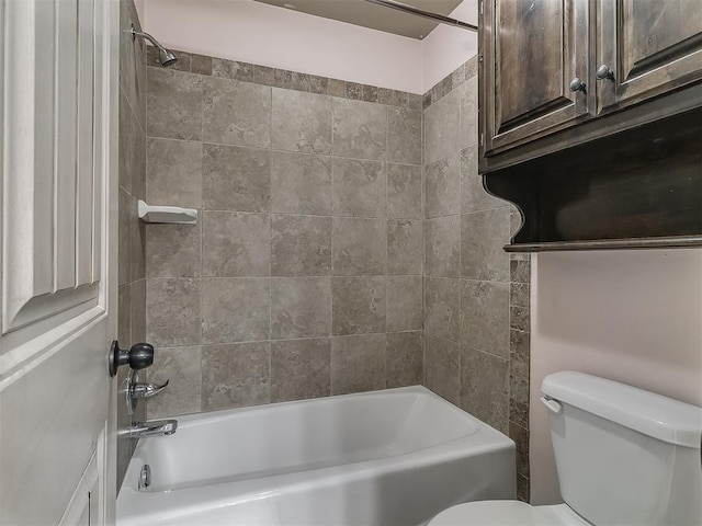 bathroom with tub / shower combination and toilet