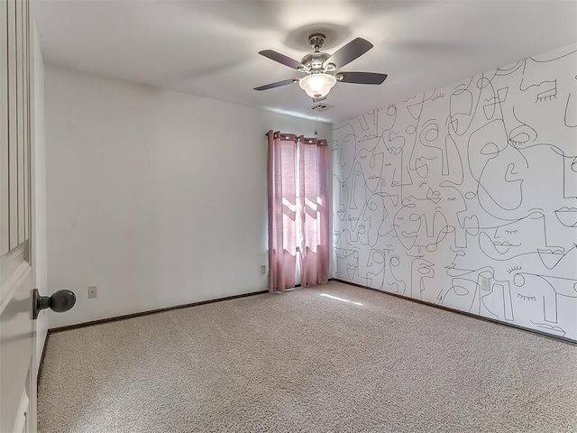 unfurnished room with visible vents, carpet flooring, a ceiling fan, and baseboards