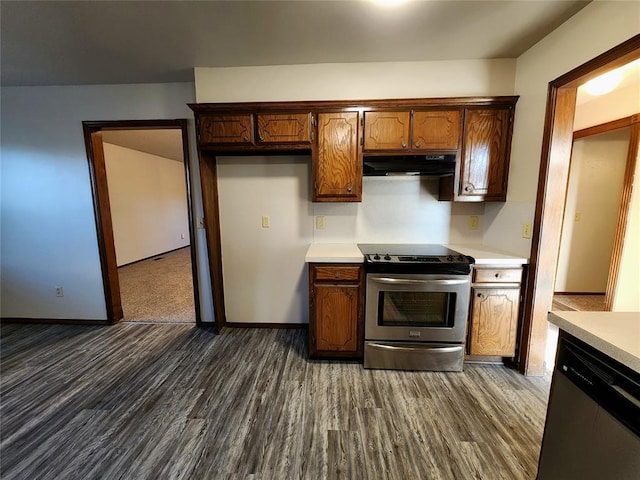 kitchen with stainless steel appliances, light countertops, and under cabinet range hood