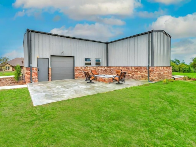 exterior space featuring a garage and a fire pit