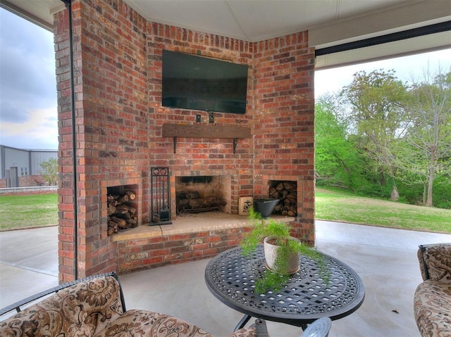 view of patio / terrace featuring an outdoor brick fireplace