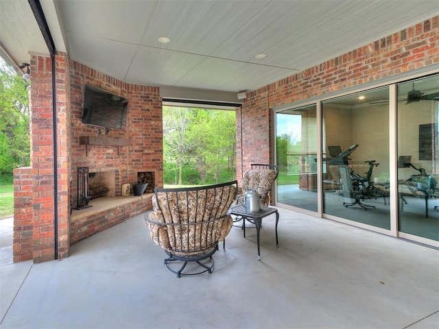 view of patio / terrace with an outdoor brick fireplace