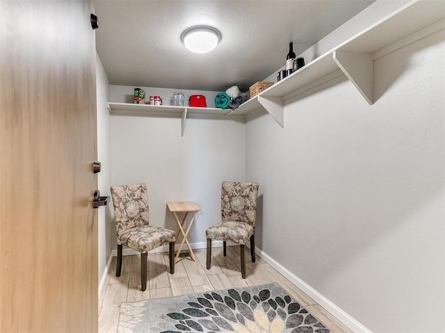 spacious closet featuring wood finish floors