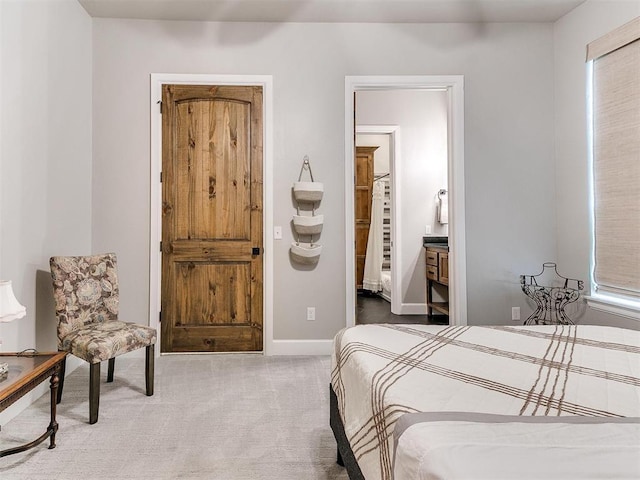 carpeted bedroom with baseboards