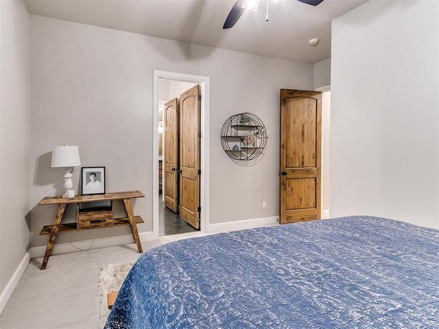 carpeted bedroom featuring a ceiling fan and baseboards