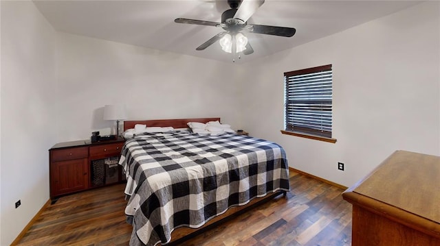 bedroom featuring a ceiling fan, baseboards, and dark wood-style flooring