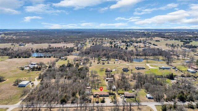 birds eye view of property featuring a rural view